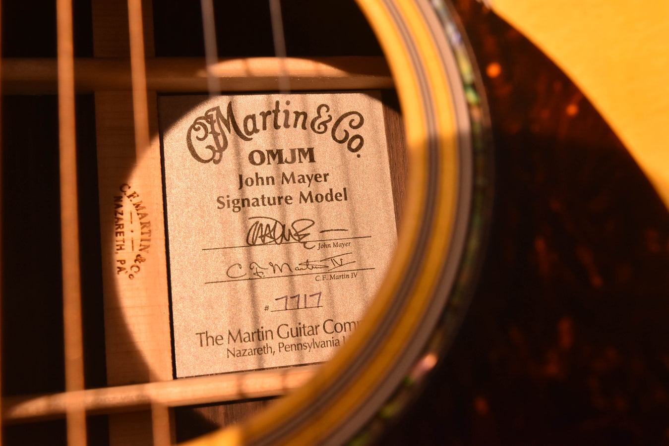 OMJM John Mayer Signature Model label on acoustic-electric guitar body