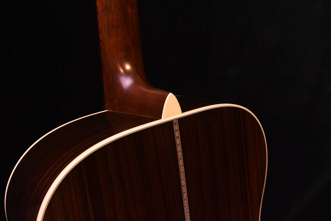 Acoustic-electric guitar neck joint and upper bout with decorative inlay on fretboard