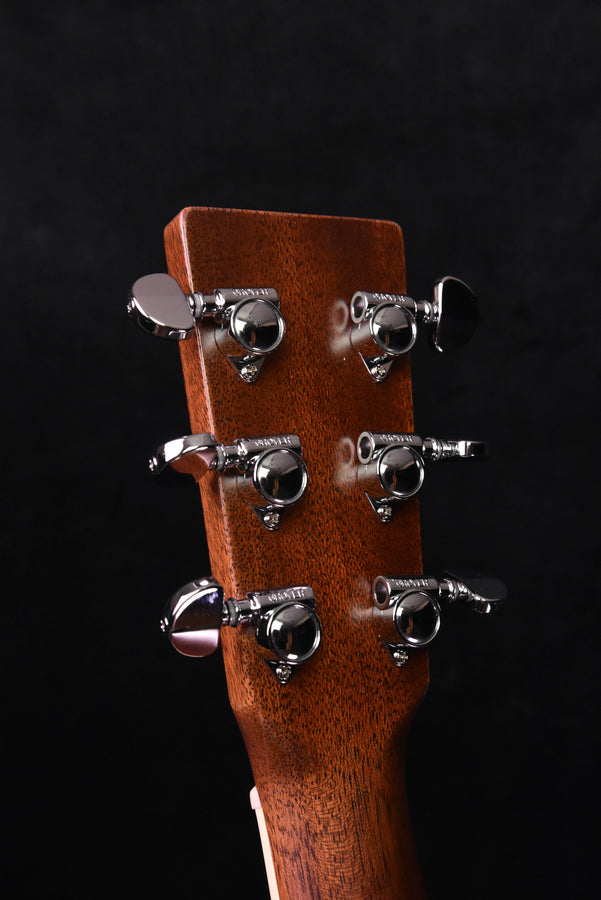 Acoustic guitar headstock with six chrome tuning pegs