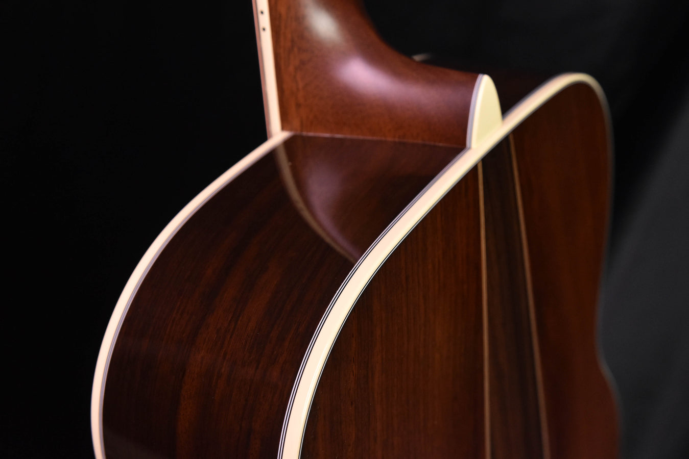 Acoustic guitar body side and bridge area with cream binding
