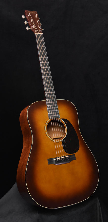 Acoustic guitar in amber burst finish, dreadnought body with soundhole and fretboard