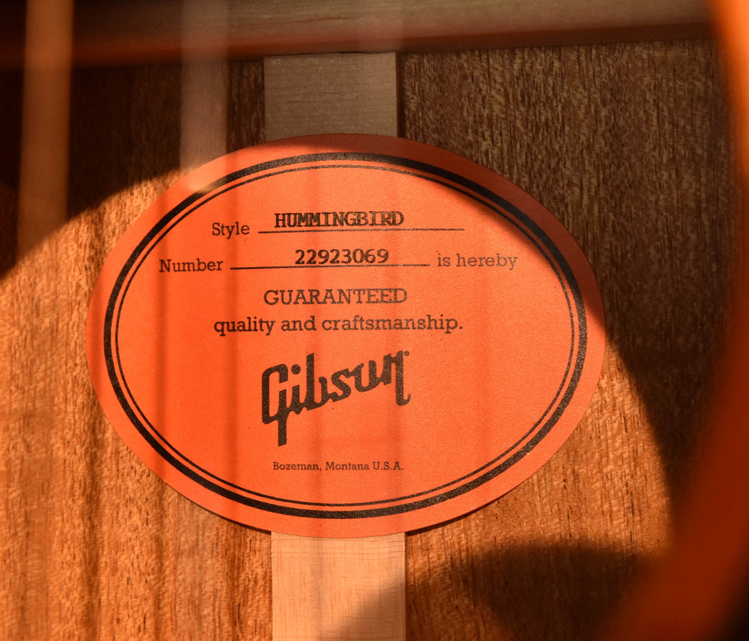 Gibson acoustic guitar inspection label inside, 'HUMMINGBIRD' and 'Guaranteed quality'