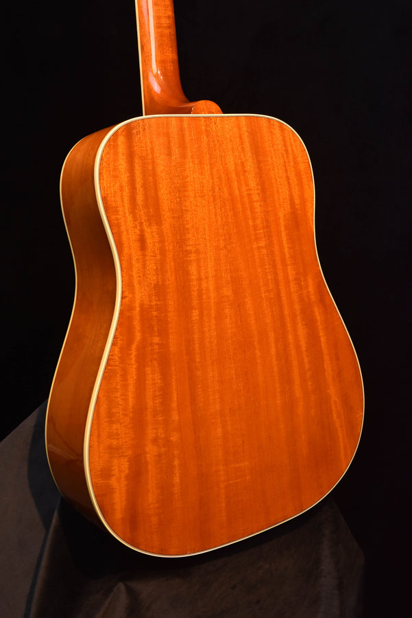 Angled acoustic guitar body in cherry sunburst with cream outline
