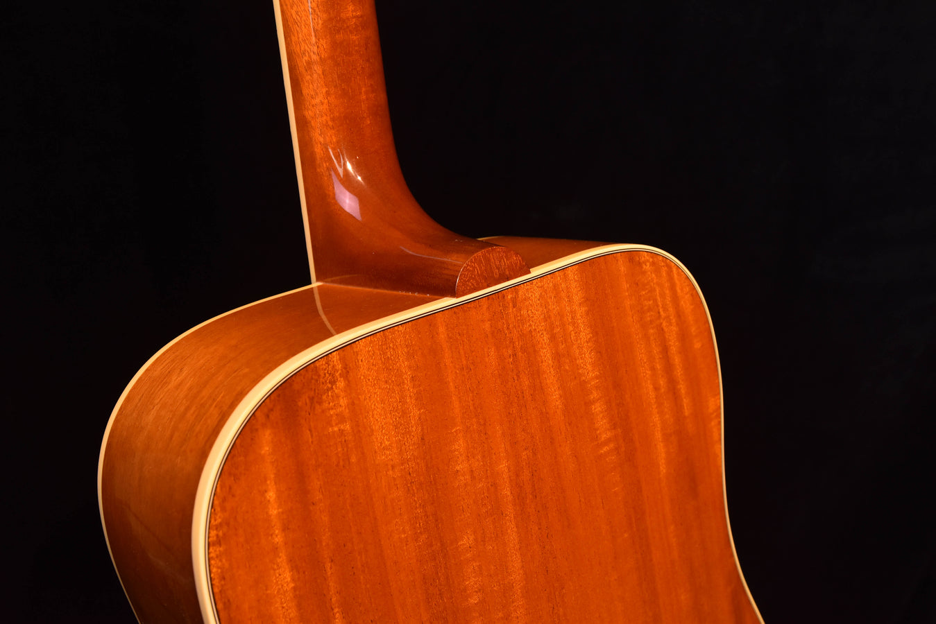 Acoustic guitar neck and upper bout in glossy cherry, cream binding