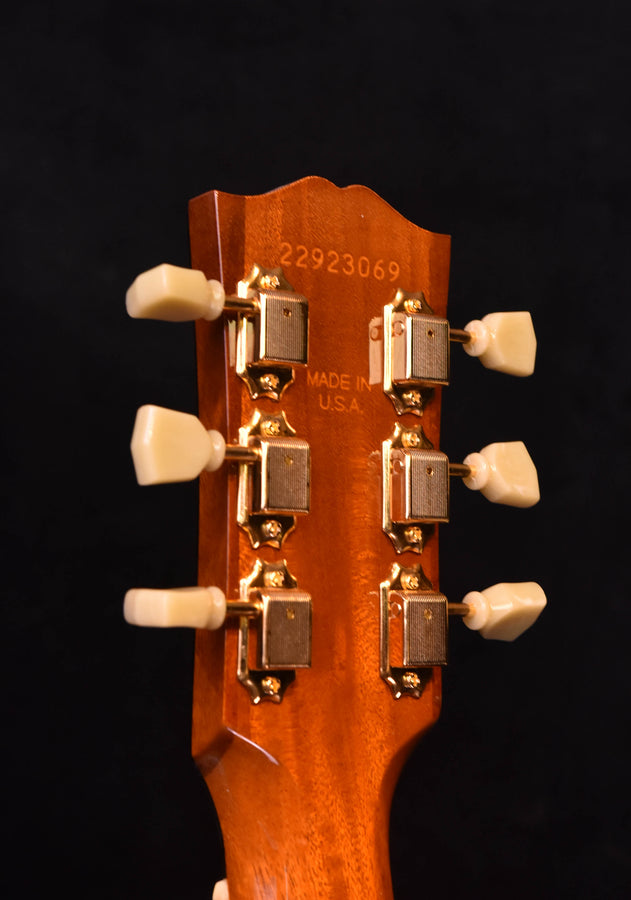 Acoustic guitar headstock with tuning pegs and 'Made in USA' stamp