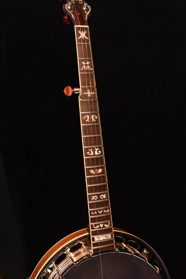 Banjo headstock with decorative peghead inlays and chrome tuning hardware