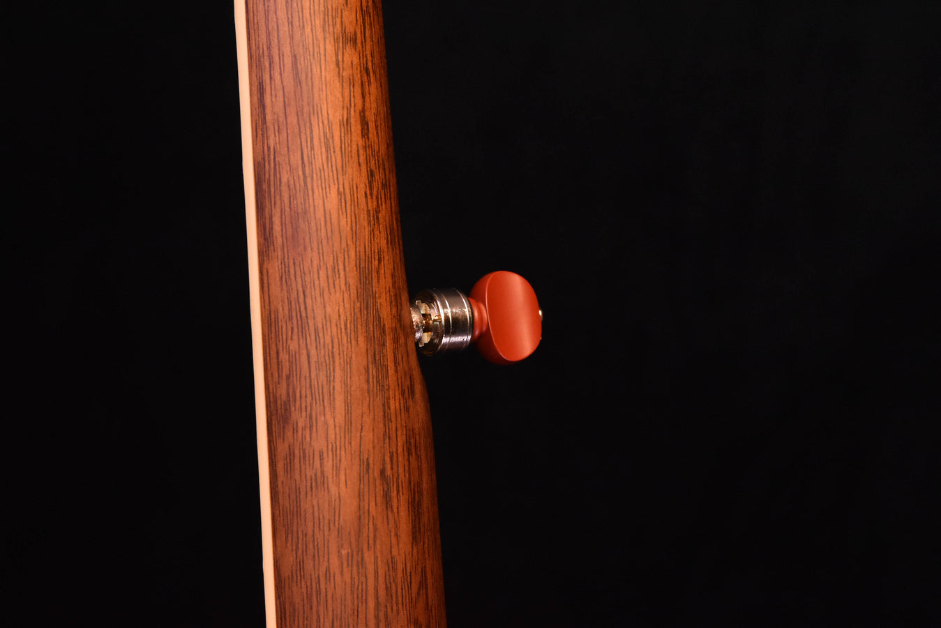 Banjo tuning knob on the headstock, red end cap with chrome hardware