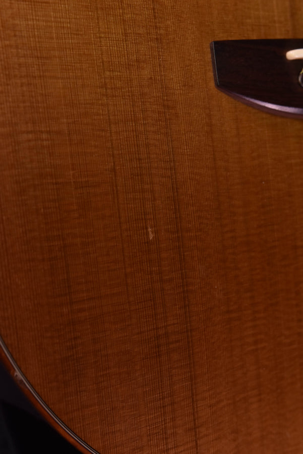 Used McPherson acoustic guitar, body texture and bridge corner close-up