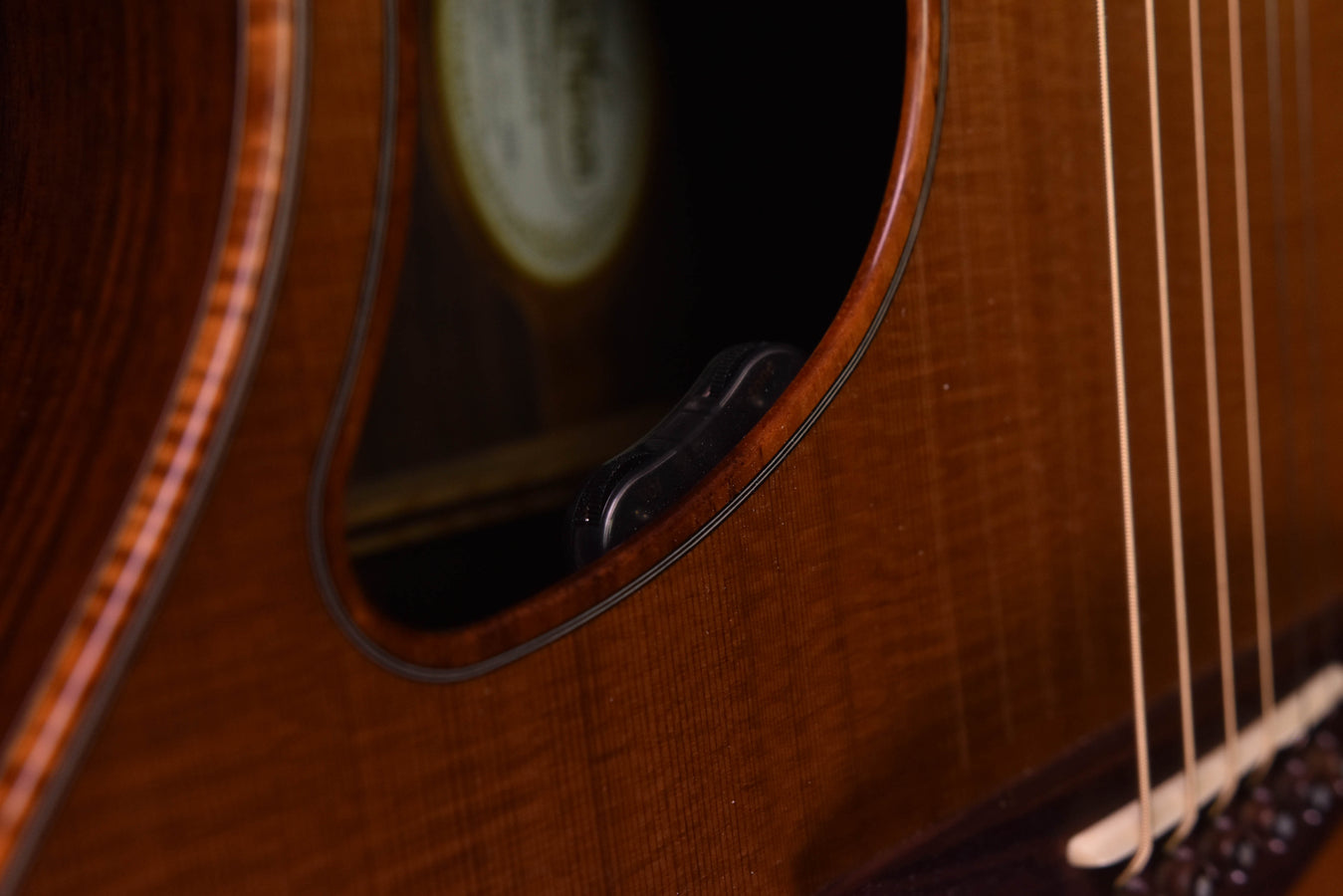 Used McPherson acoustic guitar, rosette and strap button area near the sound hole