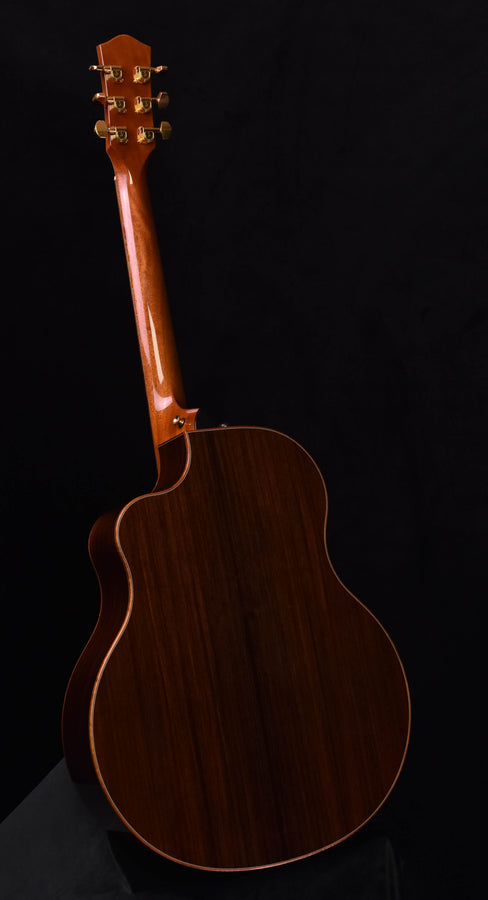 Used McPherson acoustic guitar, dark wood body with carved headstock and gold tuners