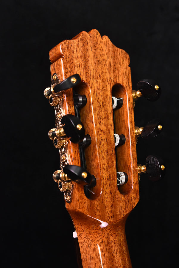 Headstock and tuning pegs of classical guitar with decorative inlay