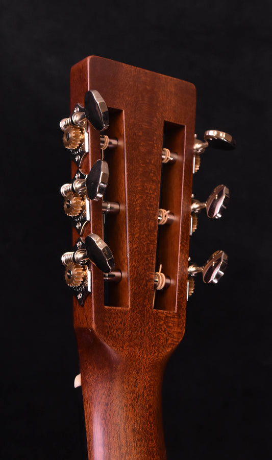 Mahogany guitar headstock with six tuners and split-plate design, used condition