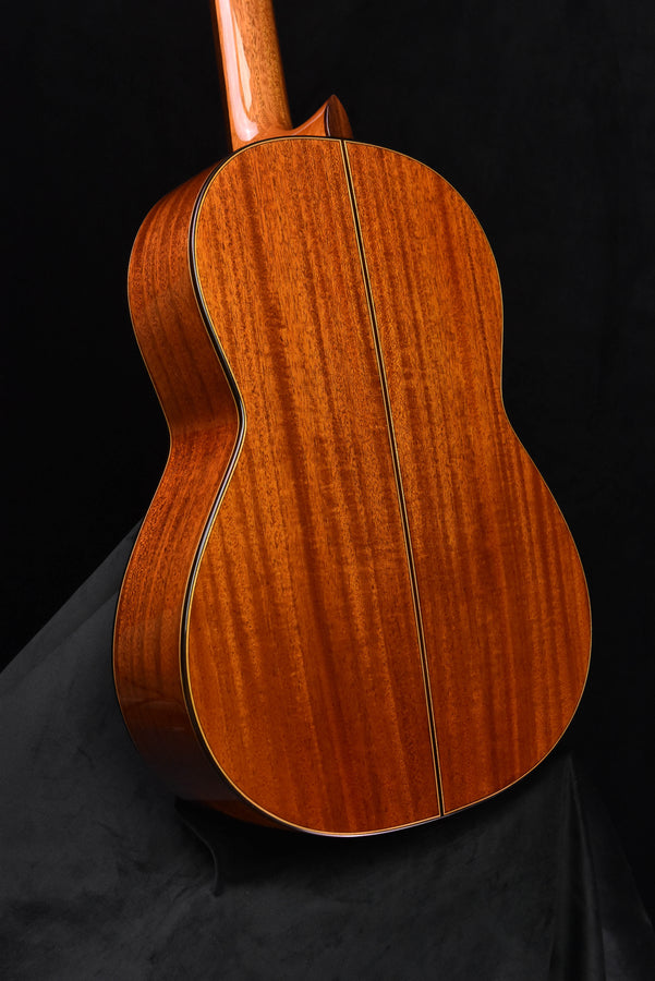 Curved back of classical guitar with center seam, natural wood finish