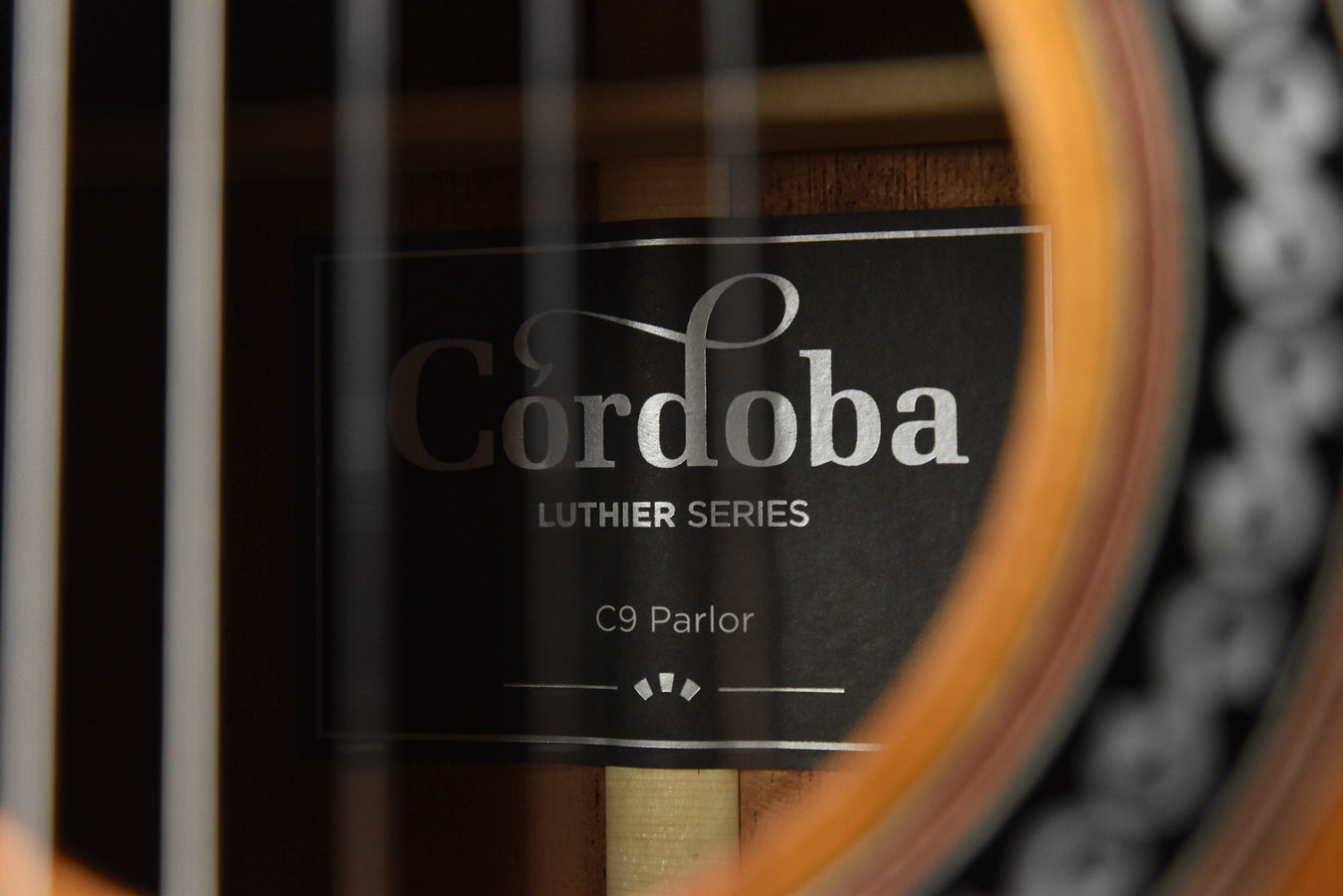 Cordoba C9 Parlor classical guitar headstock label inside case
