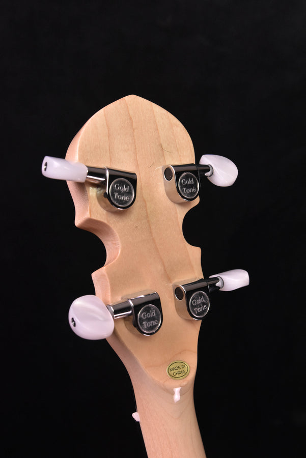 Banjo headstock close-up with “Gold Tone” tuners and “Made in China” label