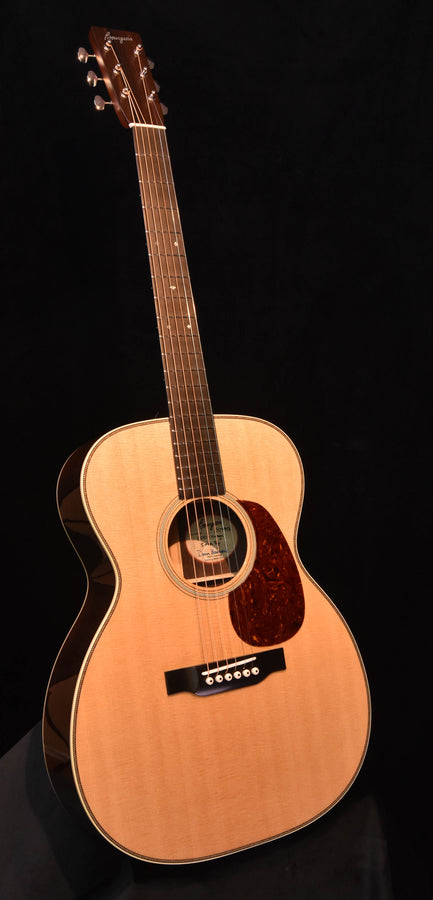 Bourgeois vintage pro series acoustic guitar, light wood top with dark pickguard and soundhole