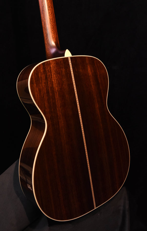 Dark acoustic guitar back with cream binding and long center seam detail