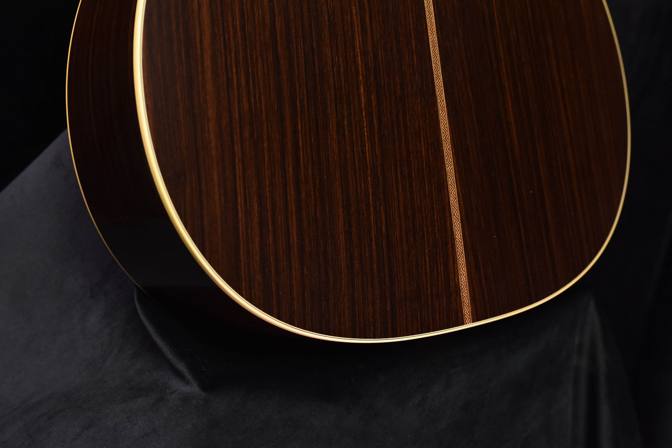 Acoustic guitar top with rosette and dark wood grain, Ambertone finish