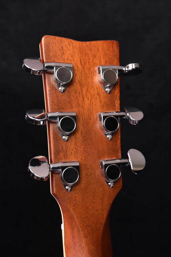 Acoustic guitar headstock with six chrome tuning pegs and brown finish