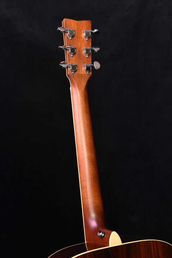 Acoustic guitar neck and headstock in warm sunburst brown wood