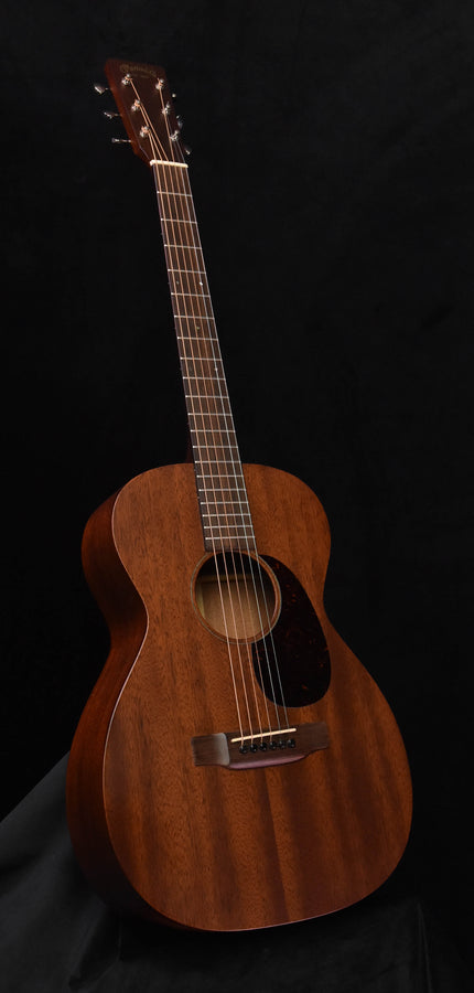 Used acoustic guitar with dark wood body and slim neck, full front view