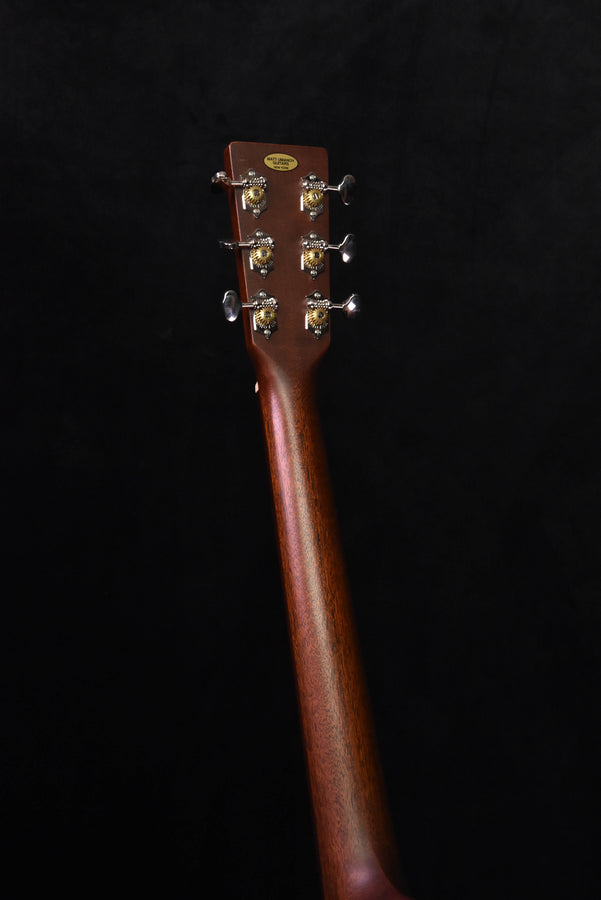 Used acoustic guitar headstock back showing tuning posts and tuning pegs