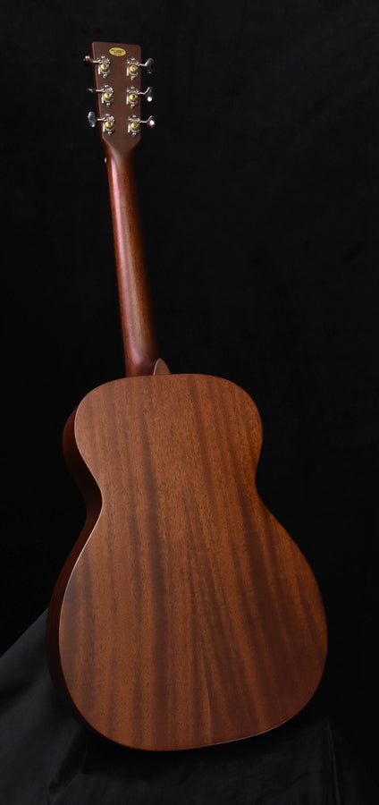 Used acoustic guitar back view with headstock and tuning pegs, full length