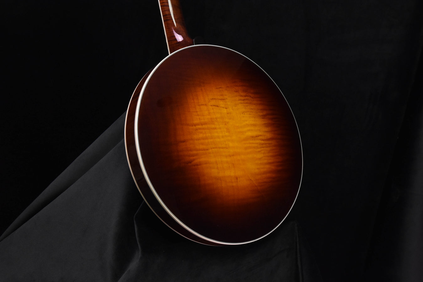 Banjo resonator with round back, white binding, amber-to-brown sunburst finish