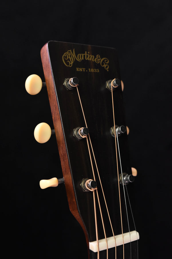 Acoustic guitar headstock with tuning machines and Martin logo, cream knobs