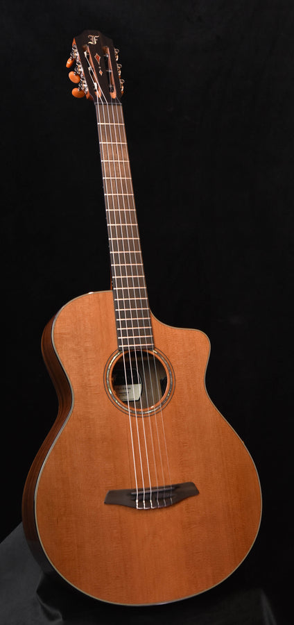 Grand nylon string acoustic guitar with crossover body, natural wood finish