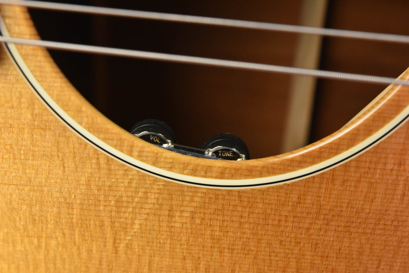 1959 J-50 acoustic guitar neck joint area, curved binding with volume/tone knobs