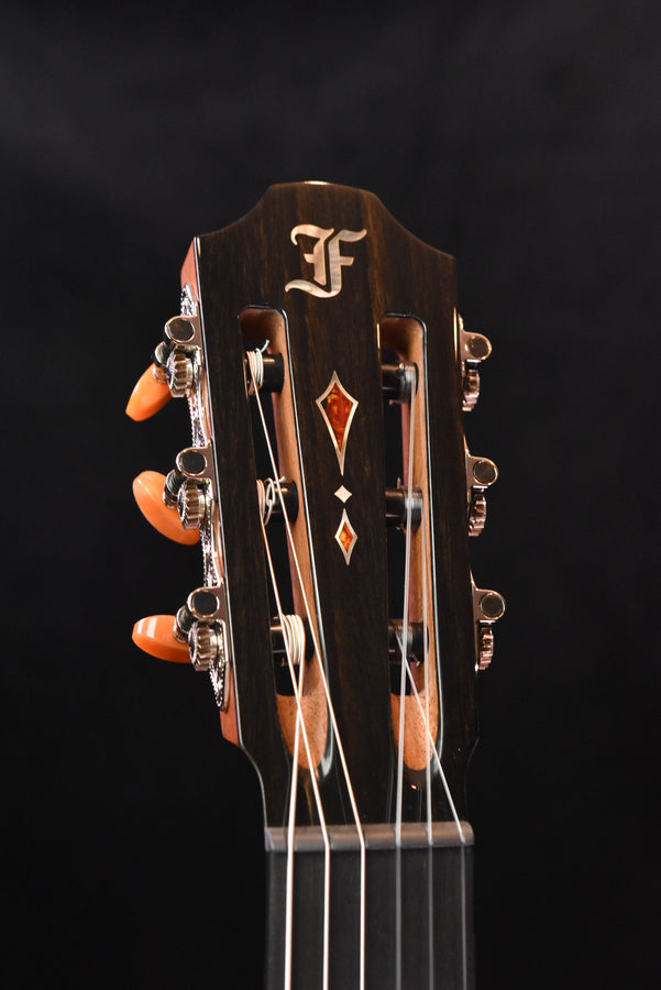Acoustic guitar headstock with Furch logo, orange tuning pegs and chrome tuners