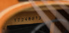 Used acoustic guitar serial number 12240013 stamped on wood