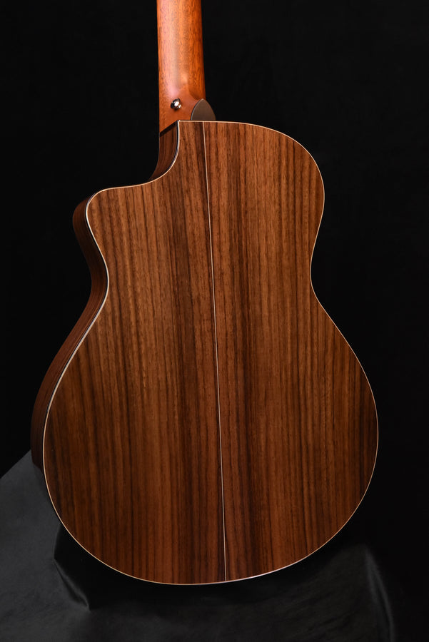 Back view of acoustic guitar body, natural wood with center seam