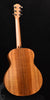 Figured koa acoustic guitar body with slotted bridge and four tuning pegs