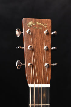 d-28e headstock back with tuning hardware and martin logo, glossy wood finish