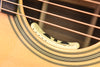 Anthem pickup on acoustic guitar soundhole rosette area with white sensor body