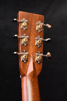 d-28e headstock front with six chrome tuners and tuning posts