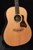 Acoustic guitar body with round sound hole, rosette and black patterned pickguard