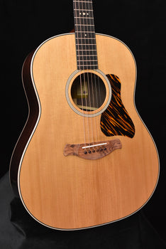 acoustic guitar body with round sound hole, rosette and black patterned pickguard