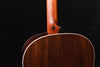 Acoustic guitar upper back near neck joint with dark wood grain