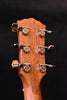 Acoustic guitar headstock back with tuning pegs and Taylor-engraved plates
