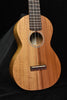 All-koa concert ukulele body front, round sound hole and bridge