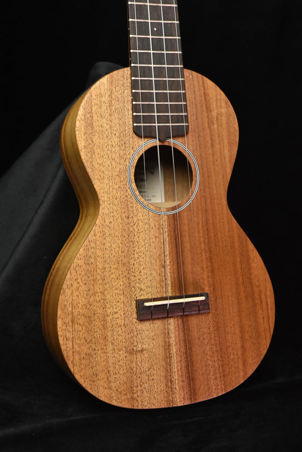 All-koa concert ukulele body front, round sound hole and bridge