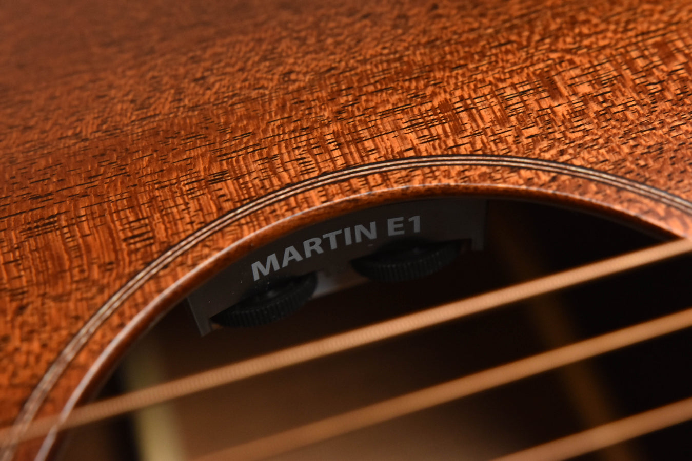Close-up of Martin E1 soundhole label on satin all-mahogany top