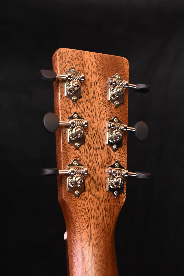 Satin all-mahogany acoustic guitar headstock with six tuning pegs, front