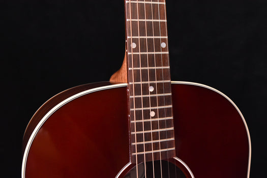 fretboard with dot inlays and frets, close-up on guitar neck