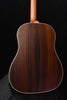 Rear view of brown acoustic guitar body with decorative binding edge