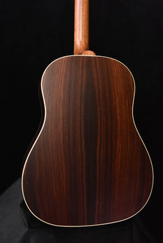 rear view of brown acoustic guitar body with decorative binding edge