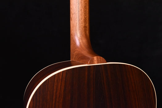 acoustic guitar neck joint and upper back, close side view